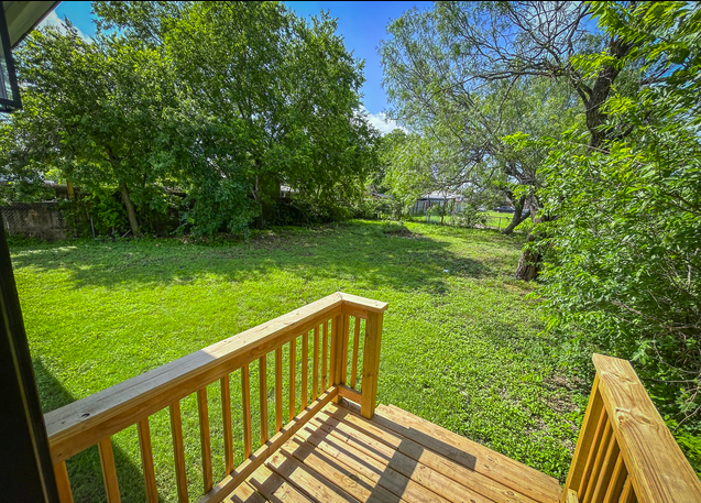 Back deck overlooking the fenced backyard